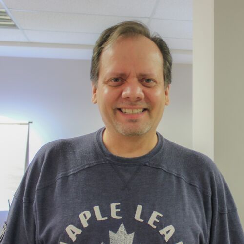 Untitled design smiling photo of John Spataro