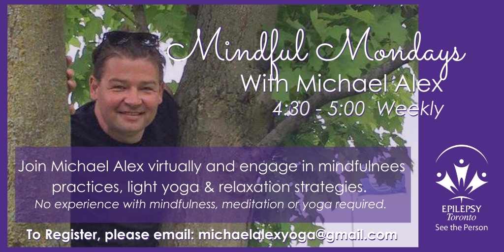 Instructor Michael Alex smiles from up in a tree