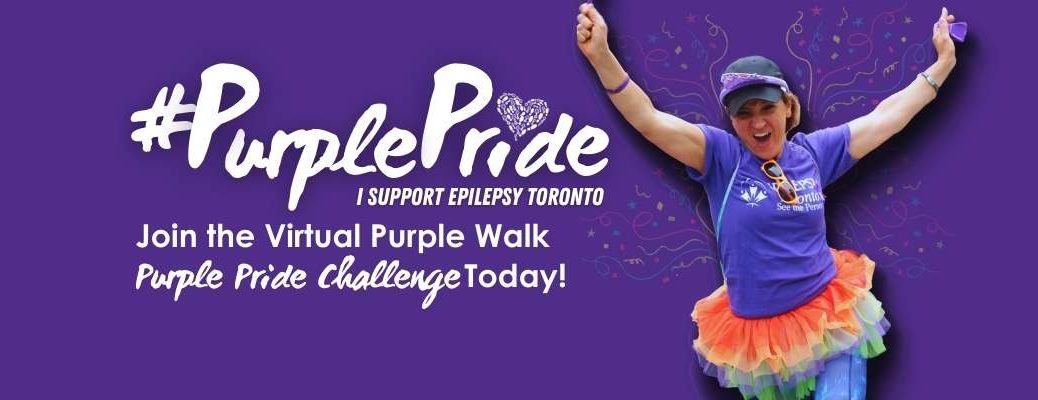 Woman in purple tshirt and colourful tutu runs with arms outstretched above her head