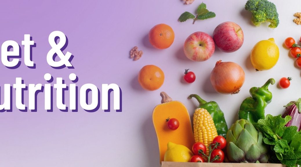 A paper shopping bag spills out an array of fresh fruits and vegetables onto a clean white surface.