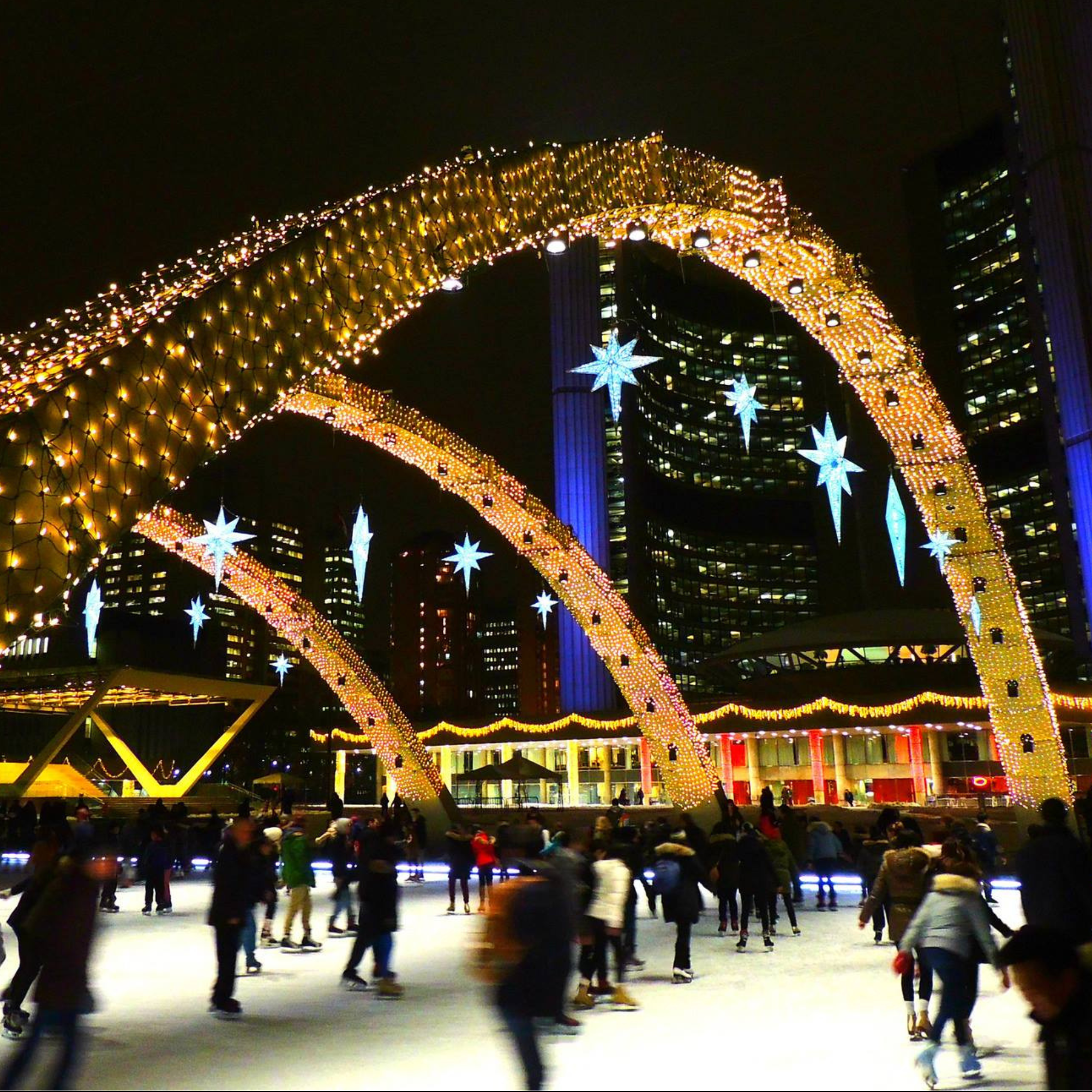 Holiday Fair Image_Skating arches over a skating rink with the To