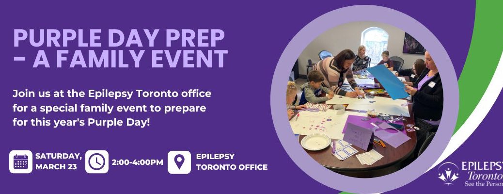 Image of families around a large table creating posters for Purple Day.
