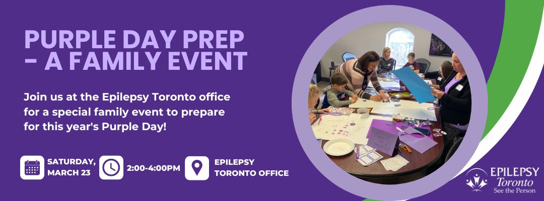 Image of families around a large table creating posters for Purple Day.